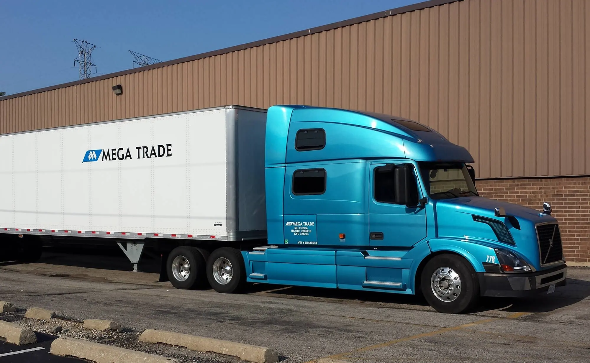 Mega Trade Volvo truck with a Mega Trade dry van trailer